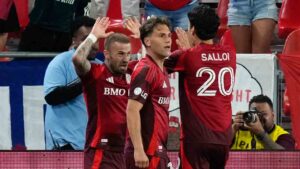 Toronto FC's Niklas Dorsch (left) celebrates with Daniel Salloi (20) and Jackson Gilman (38) after scoring against Charlotte FC during second half MLS soccer action in Toronto, on Wednesday, August 19, 2026. (Chris Young/CP)