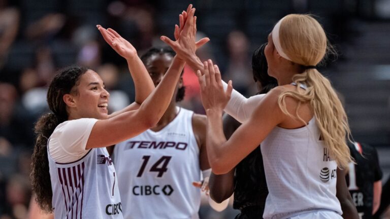 Toronto Tempo's Kiki Rice (1) celebrates with Isabelle Harrison (21) during the second half of a WNBA basketball game against the Portland Fire in Vancouver, on Friday, August 21, 2026. THE CANADIAN PRESS/Ethan Cairns