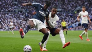 Newcastle United's Anthony Elanga (left) and Tottenham Hotspur's Destiny Udogie battle for the ball during the British Premier League soccer match between Newcastle United and Tottenham Hotspur, in London, Saturday Aug. 29, 2026. (John Walton/PA via AP)