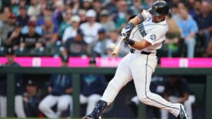 Seattle Mariners' Cal Raleigh hits a two-run home run against the Philadelphia Phillies during the first inning of a baseball game, Monday, Aug. 24, 2026, in Seattle. (AP Photo/Lindsey Wasson)