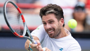 Cameron Norrie of Great Britain hits a return to Alex De Minaur of Australia during third round tennis action at the National Bank Open in Montreal on Thursday, Aug. 6, 2026. (Christinne Muschi/CP)