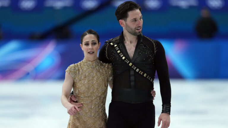 Canada's Deanna Stellato-Dudek and Maxime Deschamps leave the ice after competing during the pairs short program figure skating event at the 2026 Winter Olympics, in Milan, on Sunday, Feb. 15, 2026. (Darryl Dyck/CP)