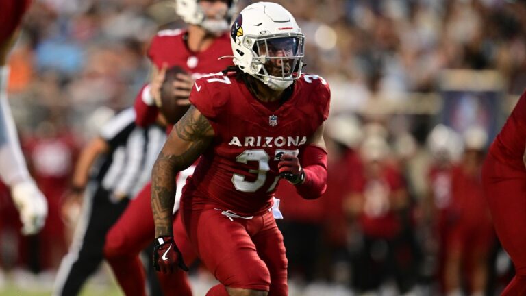 Arizona Cardinals running back Corey Kiner runs in the first half of the Pro Football Hall of Fame NFL preseason game against the Carolina Panthers in Canton, Ohio, Thursday, Aug. 6, 2026. (AP Photo/David Dermer)