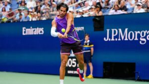Carlos Alcaraz, of Spain, returns the ball during a mixed doubles match at the U.S. Open tennis championships, Tuesday, Aug. 25, 2026, in New York. (Yuki Iwamura/AP)
