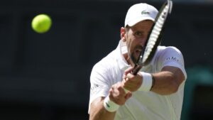 Novak Djokovic, of Serbia, returns the ball to Roman Saffiullin, of Russia, in their fourth round men's singles match at the Wimbledon Tennis Championships in London, July 5, 2026. (Brian Inganga/AP)