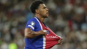 PSG's Desire Doue celebrates after scoring his side's second goal during the UEFA Super Cup soccer match between Paris Saint-Germain and Aston Villa in Salzburg, Austria, Wednesday, Aug. 12, 2026. (AP Photo/Heinz-Peter Bader)