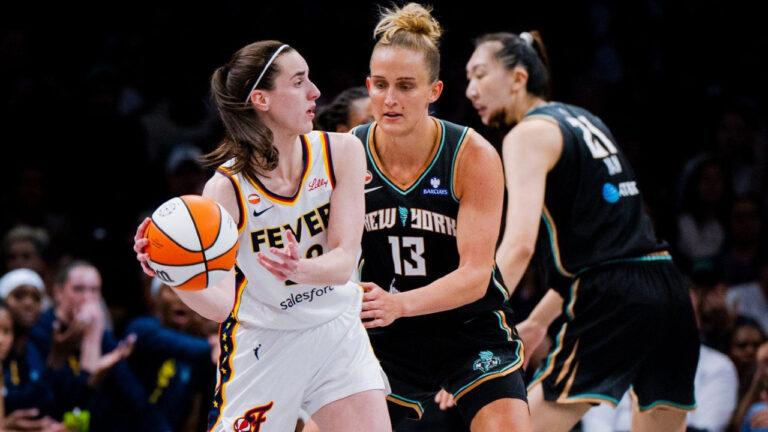 Indiana Fever guard Caitlin Clark, left, guarded by New York Liberty forward Leonie Fiebich (13), looks to pass the ball during the first half of a WNBA basketball game, Saturday, Aug. 22, 2026, in New York. (Angelina Katsanis/AP)