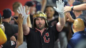 Cleveland Guardians' Austin Hedges is congratulated in the dugout after hitting a two-run home run during the sixth inning of a baseball game against the Los Angeles Angels, Monday, Aug. 24, 2026, in Anaheim, Calif. (AP Photo/Jayne Kamin-Oncea)