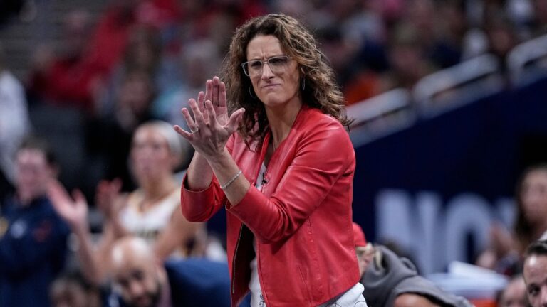 Indiana Fever head coach Stephanie White cheers as the Indiana Fever plays the New York Liberty in the first half of a WNBA basketball game in Indianapolis, Tuesday, Aug. 11, 2026. (Michael Conroy/AP)