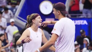 Jakub Mensik, of the Czech Republic, right celebrates with Karolina Muchova, of the Czech Republic, after they won the mixed doubles final match against Belinda Bencic, of Switzerland, and Flavio Cobolli, of Italy, at the U.S. Open tennis championships Wednesday, Aug. 26, 2026, in New York. (Frank Franklin II/AP)