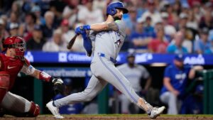 Toronto Blue Jays' Nathan Lukes follows through after hitting a run-scoring single against Philadelphia Phillies pitcher Zack Wheeler during the fourth inning of a baseball game Friday, Aug. 7, 2026, in Philadelphia. (AP Photo/Matt Slocum)