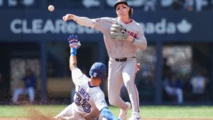 Boston Red Sox second baseman Nick Sogard (20) forces out Toronto Blue Jays outfielder Nathan Lukes (38) at second base then turns the double play over to out Blue Jays second baseman Ernie Clement (22) at first during third inning American League MLB baseball action in Toronto on Thursday, August 13, 2026. (Nathan Denette/CP)
