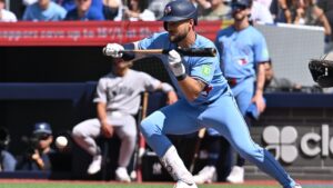 Toronto Blue Jays infielder Nathan Lukes (38) lays down a bunt against the New York Yankees during first inning MLB baseball action in Toronto on Saturday, August 15, 2026. (Jon Blacker/CP)
