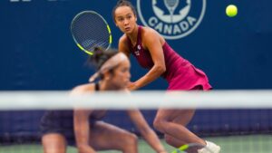 Canada's Leylah Fernandez (right) lines up a return shot in front of her sister Bianca Fernandez during their match against Elise Mertens and Diana Shnaider during National Bank Open action in Toronto on Thursday, August 6, 2026. THE CANADIAN PRESS/Chris Young