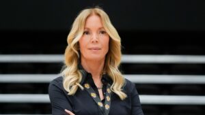 Los Angeles Lakers owner Jeanie Buss listens to JJ Redick speak after Redick was introduced as the NBA basketball team's new head coach Monday, June 24, 2024, in El Segundo, Calif. (Damian Dovarganes/AP)