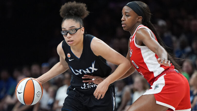 Minnesota Lynx guard Olivia Miles, left, works toward the basket as Las Vegas Aces guard Jackie Young defends during the first half of a WNBA basketball game in Minneapolis, Saturday, Aug. 8, 2026. (Abbie Parr/AP)