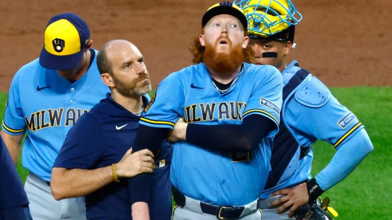 Milwaukee Brewers pitcher Dustin May reacts after being hit by a batted ball during the first inning of a baseball game against the New York Mets, Wednesday, Aug. 26, 2026, in New York. (AP Photo/Noah K. Murray)