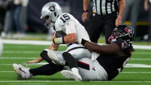 Las Vegas Raiders quarterback Fernando Mendoza (15) is sacked by Houston Texans defensive tackle Kayden McDonald (93) during the first half of an NFL preseason football game Thursday, Aug. 20, 2026, in Houston. (AP Photo/David J. Phillip)