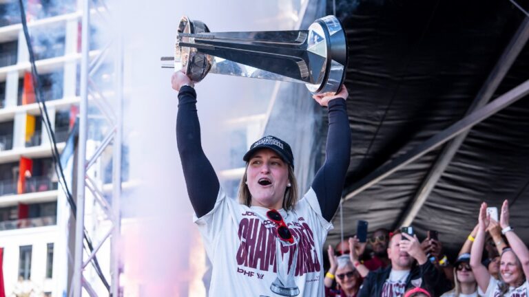 Montreal Victoire's Marie-Philip Poulin hoists the Walter Cup in front of family, teammates and fans during the Montreal Victoire's victory celebration in Montreal, on Saturday, May 30, 2026. (Christopher Katsarov/CP)