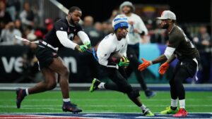 NFC wide receiver George Pickens (3), of the Dallas Cowboys, is tackled by AFC linebacker Azeez Al-Shaair (0), of the Houston Texans, during the second half of the NFL Pro Bowl football game, Tuesday, Feb. 3, 2026, in San Francisco. (Godofredo A. Vásquez/AP)