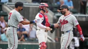 Philadelphia Phillies' Kyle Schwarber, right, celebrates with teammate Trea Turner (7) after hitting a home run during the first inning of a baseball game against the Minnesota Twins at the Field of Dreams movie site, Thursday, Aug. 13, 2026, in Dyersville, Iowa. (Charlie Neibergall/AP)