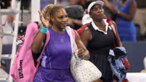 Serena Williams, left, and Venus Williams, right, both of the United States, wave to the crowd at the end of a women's doubles match against Marta Kostyuk, of Ukraine, and Peyton Stearns, also of the United States, at the Cincinnati Open tennis tournament, Monday, Aug. 17, 2026, in Mason, Ohio. (Kareem Elgazzar/AP)