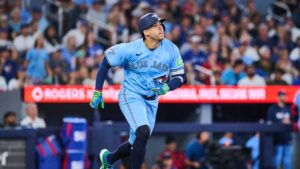 Toronto Blue Jays' George Springer (4) hits a triple during seventh inning MLB baseball action against the St. Louis Cardinals in Toronto, on Sunday, Aug. 2, 2026. (Sammy Kogan/CP)