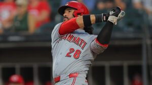 Cincinnati Reds' Eugenio Suarez watches his home run during the fifth inning of a baseball game against the Chicago White Sox, Tuesday, Aug. 11, 2026, in Chicago. (Melissa Tamez/AP)