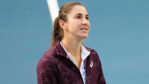 Switzerland's Belinda Bencic walks off the court after speaking to fans about her withdrawal from her quarter final match against United States' Coco Gauff due to a hip injury at the National Bank Open in Toronto on Tuesday, August 11, 2026. (Chris Young/CP)