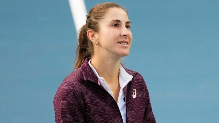 Switzerland's Belinda Bencic walks off the court after speaking to fans about her withdrawal from her quarter final match against United States' Coco Gauff due to a hip injury at the National Bank Open in Toronto on Tuesday, August 11, 2026. (Chris Young/CP)