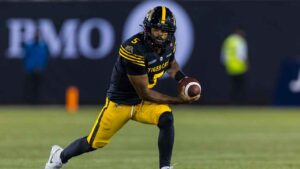 Hamilton Tiger-Cats' Tre Ford carries the ball during second half CFL football action in Hamilton on Saturday, August 15, 2026. (Michael P. Hall/THE CANADIAN PRESS)