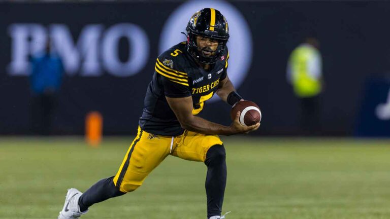 Hamilton Tiger-Cats' Tre Ford carries the ball during second half CFL football action in Hamilton on Saturday, August 15, 2026. (Michael P. Hall/THE CANADIAN PRESS)
