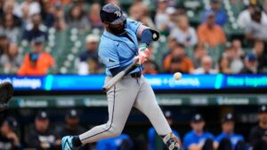 Tampa Bay Rays' Junior Caminero hits a ground ball that scores Yandy DÃaz during the first inning of a baseball game Monday, Aug. 24, 2026, in Detroit. (Paul Sancya/AP)