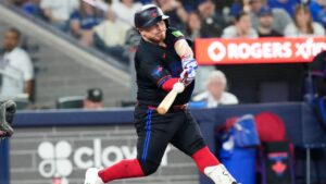 Toronto Blue Jays Alejandro Kirk (30) hits a home run off New York Yankees pitcher Bradley Hanner (93) during eighth inning MLB baseball action in Toronto on Friday, August 14, 2026. (Chris Young/CP)