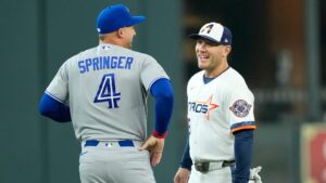Toronto Blue Jays' George Springer (4) talks with former teammate Houston Astros' Daulton Varsho who was traded before their baseball game Monday, Aug. 3, 2026, in Houston. (David J. Phillip/AP)