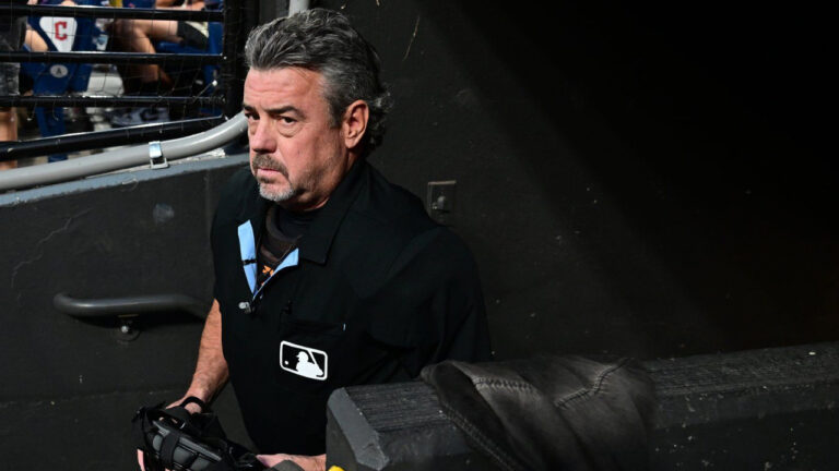 Umpire Rob Drake enters the field after home plate umpire Jordan Baker had to leave the game during the fifth inning of a baseball game between the Cleveland Guardians and San Francisco Giants, Tuesday, Aug. 18, 2026, in Cleveland. (David Dermer/AP)