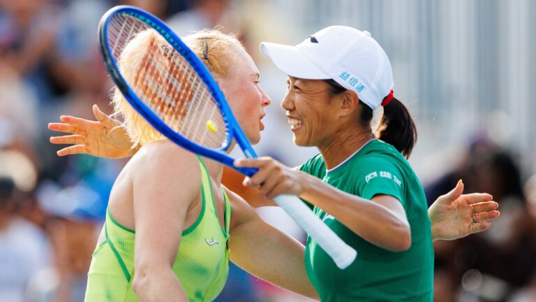 Katerina Siniakova of Czechia, left, hugs her teammate Shuai Zhang of China after they defeated Coco Gauff and Caty McNally of the United States 6-0, 6-4, in their doubles match during National Bank Open tennis action in Toronto, on Saturday, Aug. 8, 2026. THE CANADIAN PRESS/Keito Newman
