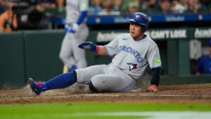 Toronto Blue Jays' Kazuma Okamoto scores during the fourth inning of a baseball game against the Houston Astros Monday, Aug. 3, 2026, in Houston. (AP Photo/David J. Phillip)