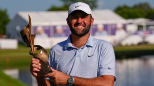 Scottie Scheffler holds the winning trophy after the final round of the St. Jude Championship golf tournament, Sunday, Aug. 16, 2026, in Memphis, Tenn. (AP Photo/George Walker IV)