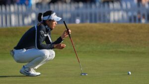 Jeeno Thitikul, of Thailand, lines up a putt on the 18th green during the third round of the Women's British Open golf championship in Lytham St Annes, England, Saturday, Aug. 1, 2026. (AP Photo/Jon Super)