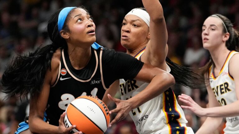 Atlanta Dream forward Angel Reese (5) shoots the ball against Indiana Fever forward Makayla Timpson (21) in the first half of an WNBA basketball game Sunday, Aug. 16, 2026, in Atlanta. (AP Photo/Brynn Anderson)