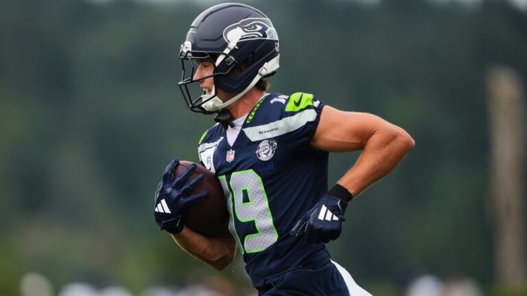 Seattle Seahawks wide receiver Jake Bobo smiles while running the ball during the NFL football team's training camp, Saturday, July 25, 2026, in Renton, Wash. (AP Photo/Lindsey Wasson)