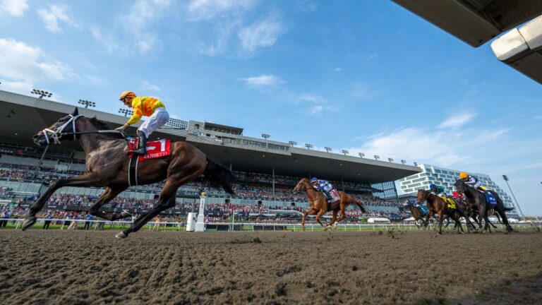 Jockey Pietro Moran (left) celebrates while riding Mansetti to win the King's Plate horse race, in Toronto, Saturday, Aug. 16, 2025. THE CANADIAN PRESS/Frank Gunn