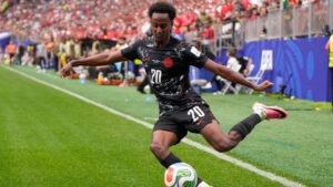 Canada's Ali Ahmed (20) kicks the ball during the World Cup round of 16 soccer match between Canada and Morocco in Houston, Saturday, July 4, 2026. (AP Photo/Ashley Landis)