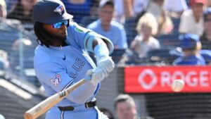Toronto Blue Jays' Charles McAdoo hits an RBI double against the New York Yankees, scoring Ernie Clement during seventh inning MLB action in Toronto, Saturday, Aug. 15, 2026. (Jon Blacker/CP)