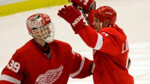 Detroit Red Wings goalie Dominik Hasek (39) is congratulated by Nicklas Lidstrom after the Red Wings' 4-2 victory over the Nashville Predators in Game 2 of the Western Conference quarterfinal in Detroit, Saturday, April 12, 2008. (Carlos Osorio/AP)