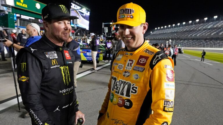 Kurt Busch, left, and Kyle Busch talk on pit road during qualifying for the NASCAR Daytona 500 at Daytona International Speedway, Wednesday, Feb. 16, 2022, in Daytona Beach, Fla. (John Raoux/AP)