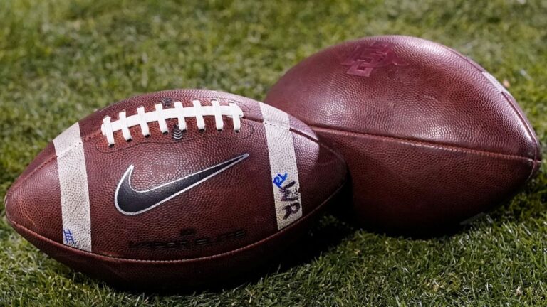 Footballs rest on the field in the second half of an NCAA college game Nov. 28, 2020, in Boulder, Colo. (David Zalubowski/AP)