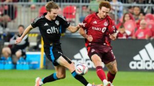 Toronto FC's Josh Sargent (right) and Charlotte FC's Henry Kessler (22) vie for the ball during first half MLS action in Toronto, on Wednesday, Aug. 19, 2026. (Chris Young/CP)
