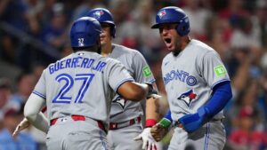 Toronto Blue Jays' George Springer, right, celebrates with Vladimir Guerrero Jr. after scoring during the eighth inning of a game against the Phillies, Saturday, Aug. 8, 2026, in Philadelphia. (Derik Hamilton/AP)